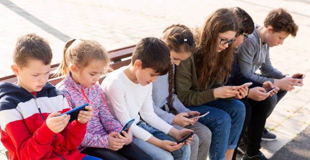istock Children communicate via messengers on phones 1331951878