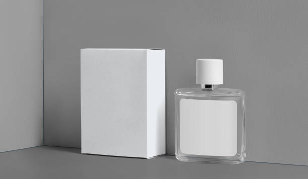 istock Mockup glass transparent bottle with label, perfume container, white cardboard box for design, isolated on gray background. 1331953277