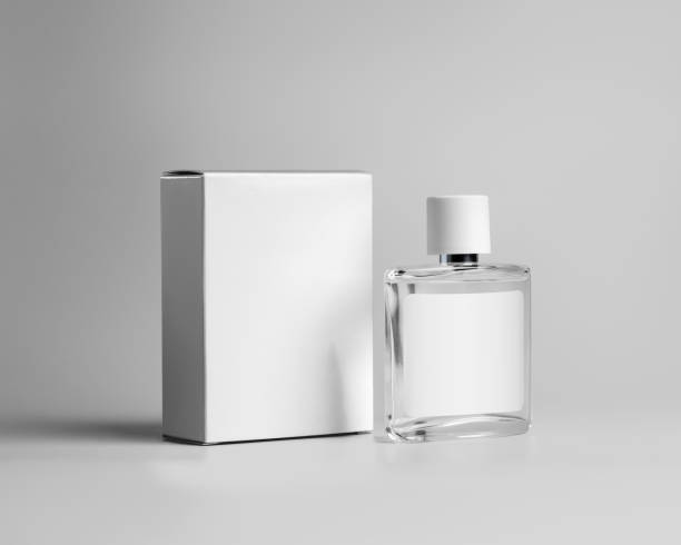 istock Mockup glass transparent bottle with label, perfume container, white cardboard box for design, isolated on gray background. 1331953297