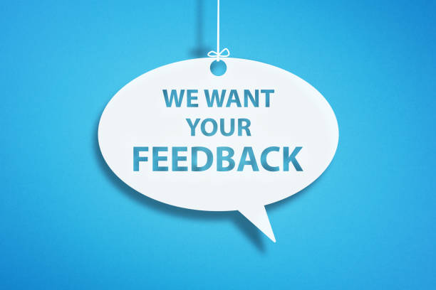 istock We Want Your Feedback written in speech bubble on blue background 1331953912