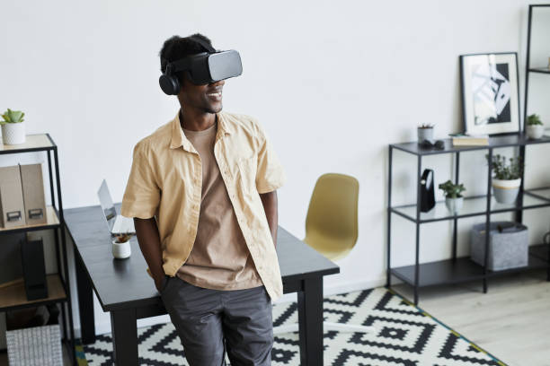 istock Businessman in VR glasses working at office 1331956662