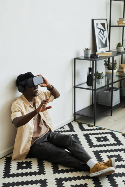 istock Man playing video game at home 1331956779