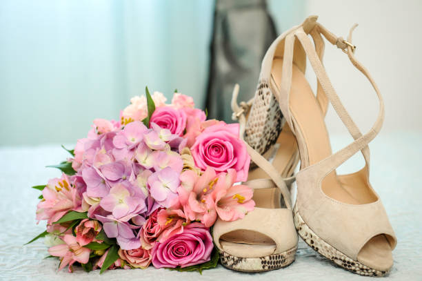 istock Wedding preparation - bridal bouquet and shoes 1331957598