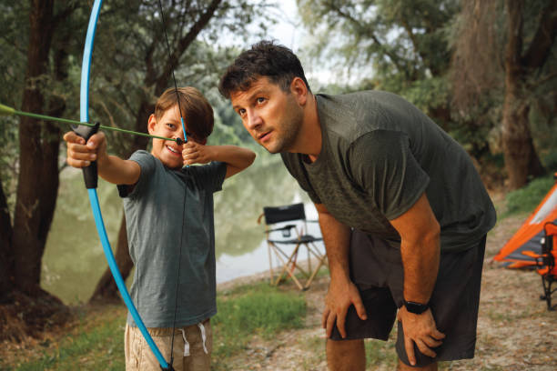 istock A boy with bow and arrow 1331959776