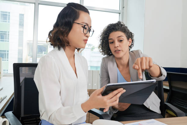 istock Angry Businesswoman Pointing out Errors 1331960171