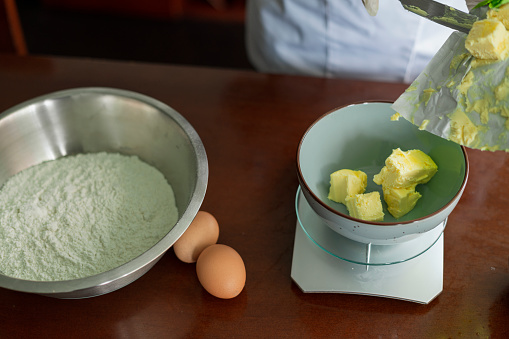 Kitchen implements for the preparation of a cake, butter, scales, ice and other articles for the preparation