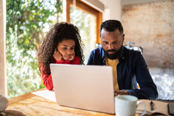 istock Mature man working at home with daughter 1331961523