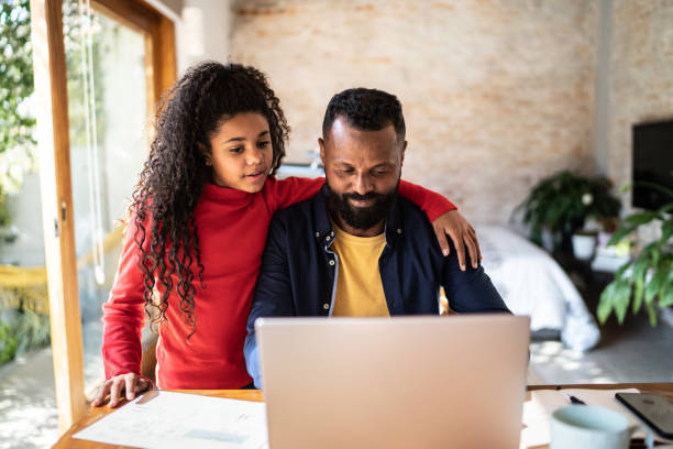 istock Mature man working at home with daughter 1331961524