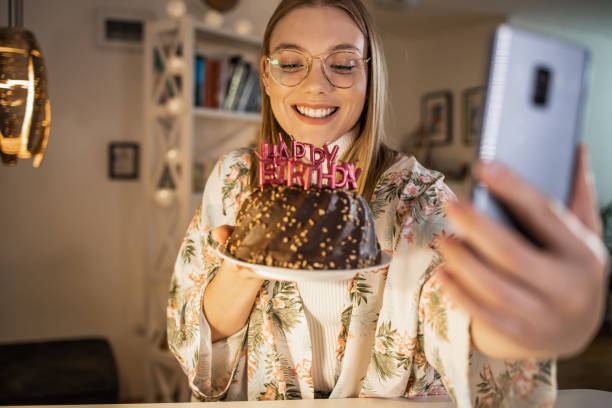 istock Wishing a birthday wish and taking selfie 1331962838