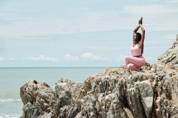 istock Woman Exercising on Rocky Beach 1331962907