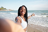 Woman Taking Selfie on Beach