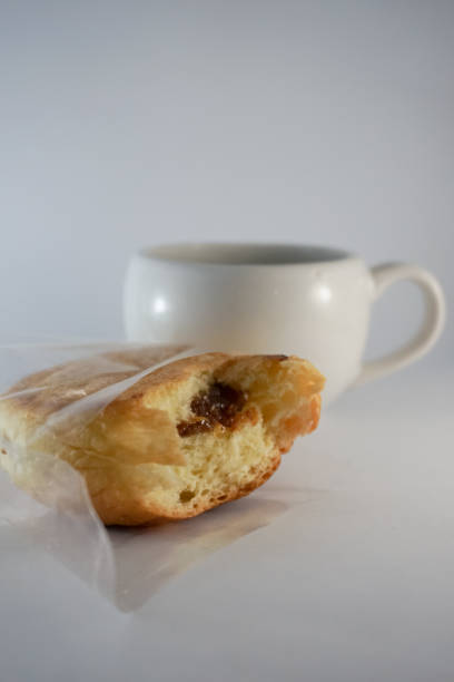 istock Slice of chocolate stuffed bread with a white mug 1331964232