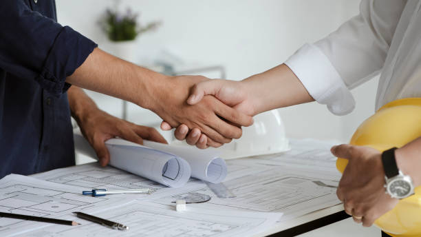istock Two engineer or architect meeting and greeting handshake after consultation and conference new project plan, makeing contract of both companies for partnership to success. 1331966340
