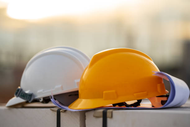 istock White and Yellow helmet hard hat safety in site construction,concept safety first. 1331969047