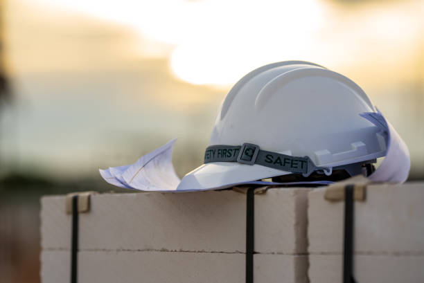 istock White and Yellow helmet hard hat safety in site construction,concept safety first. 1331969061