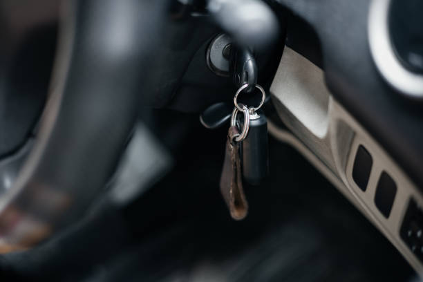 istock Car key into ignition lock. close up 1331971126
