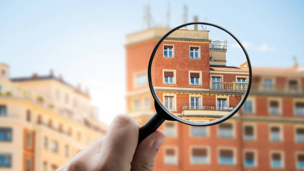istock Magnifying glass focusing a residential building 1331972146