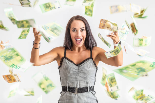 istock Young woman throws around a lot of banknotes. 1331973884