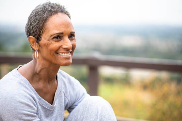 senior black woman outdoor yoga fitness lifestyle - menopause foto e immagini stock