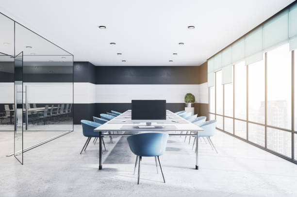istock Contemporary concrete and glass meeting room office interior with empty computer monitors, furniture, equipment and daylight. Mock up, 3D Rendering. 1331975983
