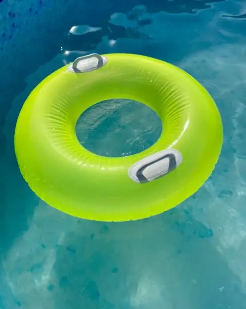 green float in the pool. summer. quality photo