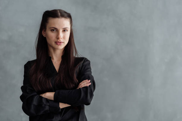 istock Young confident woman looking with crossed arms 1331978284