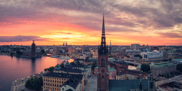 Sunset in Stockholm on a summer evening Aerial view of Stockholm in summer. In the foreground is Riddarholmen church, and in the background to the left is the Stockholm city hall. kungsholmen town hall photos stock pictures, royalty-free photos & images