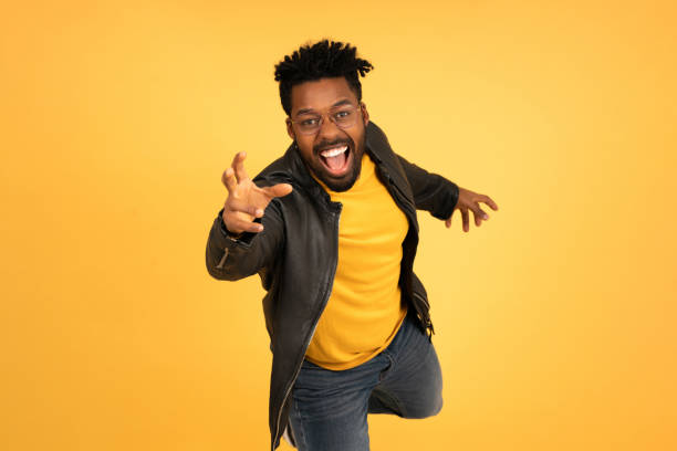 istock Young afro man trying to catch something with his hand. 1331979298