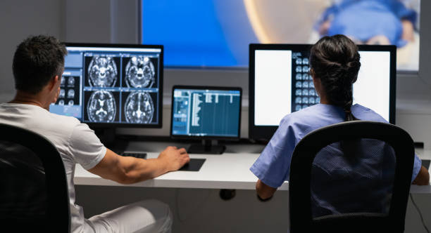 istock Back View Of Two Doctors Analyzing MRI Scan Results 1331982083