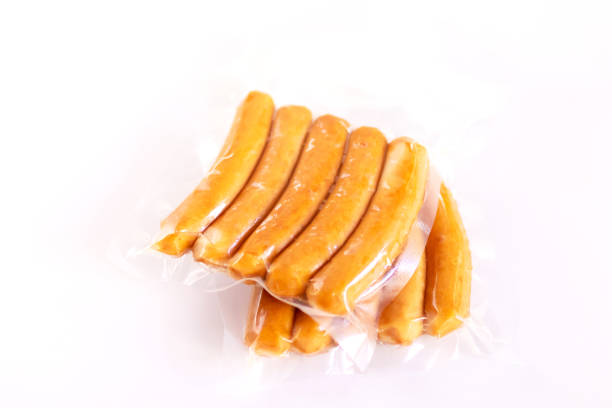 istock Chicken sausage in vacuum package isolated on white background. 1331983951