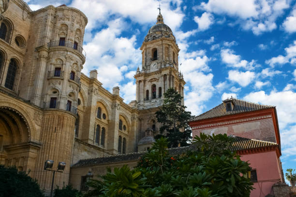 istock Malaga city cathedral with its main tower in cloudy day and blue sky. 1331983997