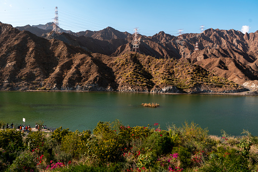 Beautiful travel Destination in Khorfakan Sharjah Al Rafisah Dam, Hajar mountains with greenery, best place for boating and hiking in UAE