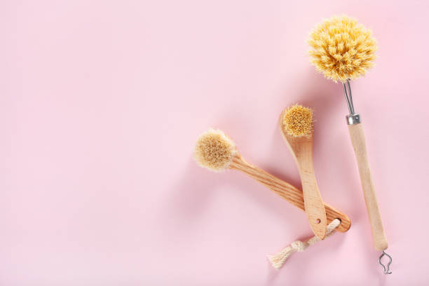 istock zero waste eco friendly cleaning concept. wooden brushes on pink background 1331986257