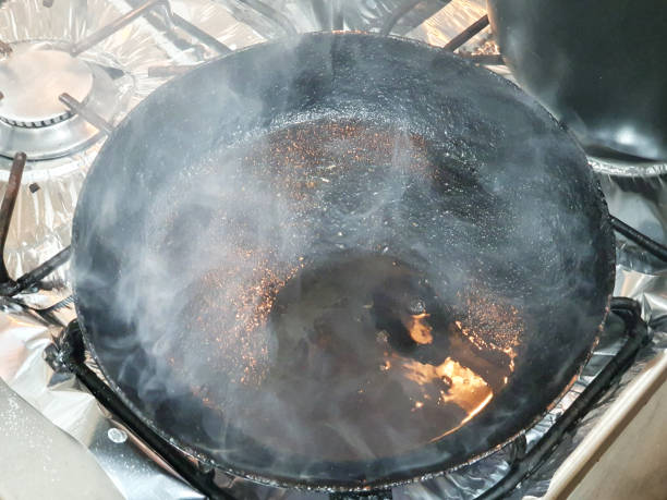istock Frying pan very hot, smoke coming out 1331986288