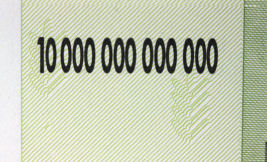 The text is ten Trillion dollars closeup on a Zimbabwe banknote.