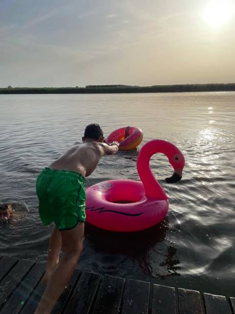 istock Boy is jumping in the water. 1331990263