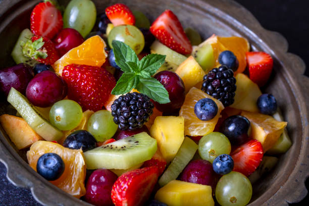istock Dietary fruit salad with fresh summer fruits 1331990614