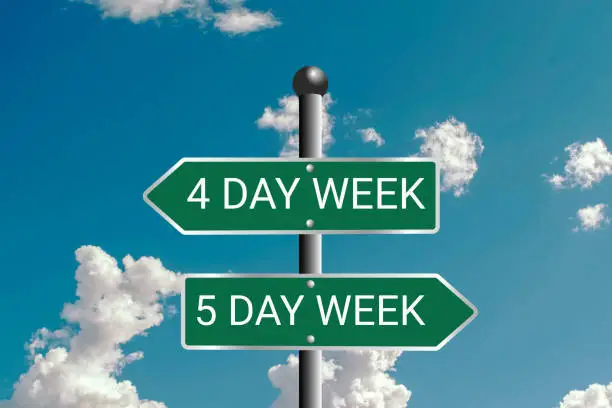 Photo of Five-day or Four-day workweek - Traffic sign with text - 4-day or 5-day work week ( 2-day or 3-day weekend ). Employees, employment, holiday, Question of productivity and efficiency
