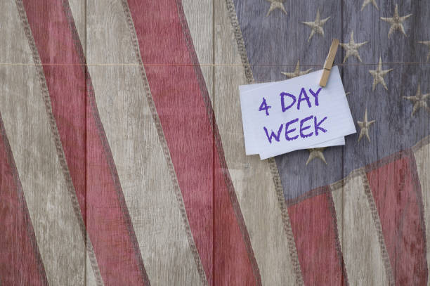istock Five-day or Four-day workweek -note with text : 4-days work week against us flag. Concept for Employees and their time in employment. Question of productivity and efficiency 1331990799