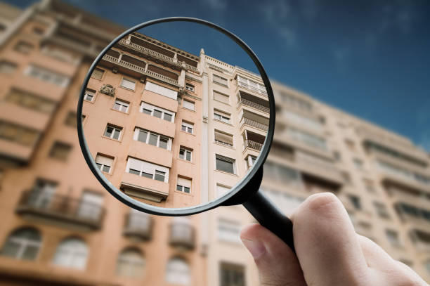 istock Magnifying glass focusing a residential building 1331991599