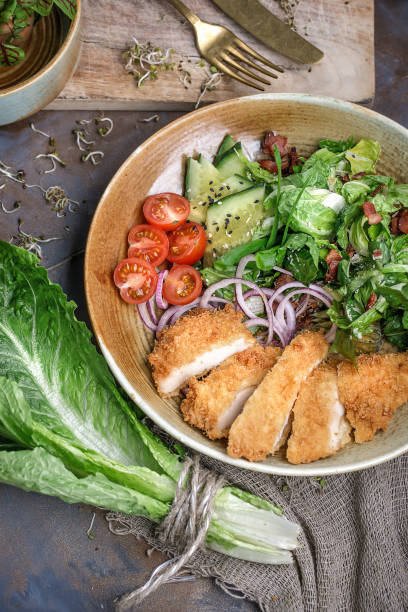 istock Delicious fresh salad with crispy grilled chicken breast 1331991624