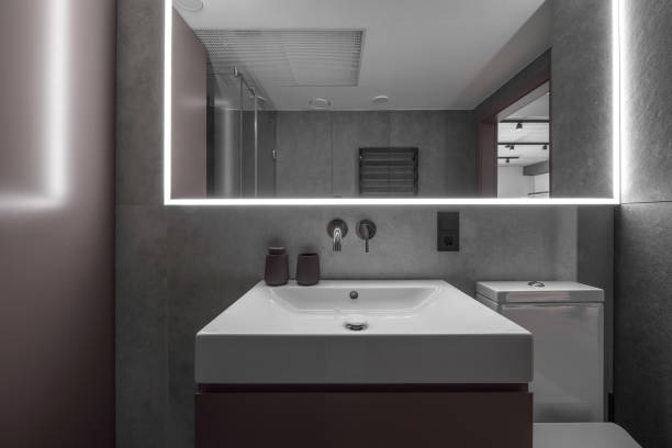 istock Modern minimalist bathroom interior design with grey stone tiles 1331991655