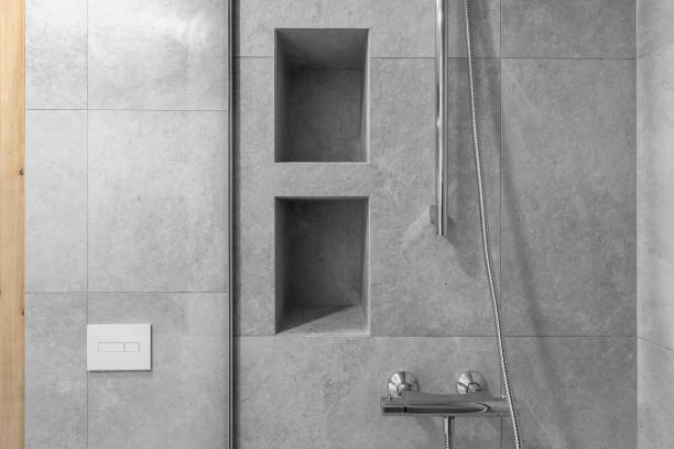 istock Modern minimalist bathroom interior design with grey stone tiles and wood wall texture 1331991693