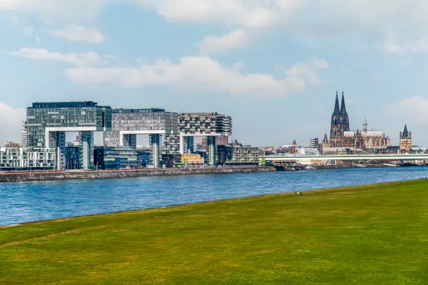 Photo of Cologne Koln, Germany, Panorama view of the Rhine River with Kranhaus Buildings, Rheinauhafen and Dom Cathedral
