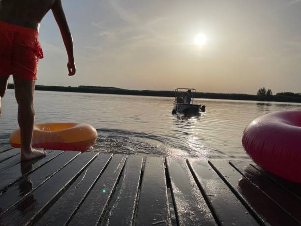 istock Having fun on the river, swimming and jumping in water. 1331995402