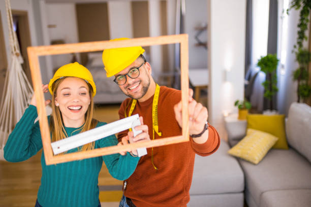 istock Young couple decorating their home. 1331997766