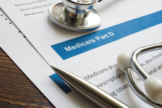 istock Stethoscope with medicare part D drug coverage info and pen. 1331999140