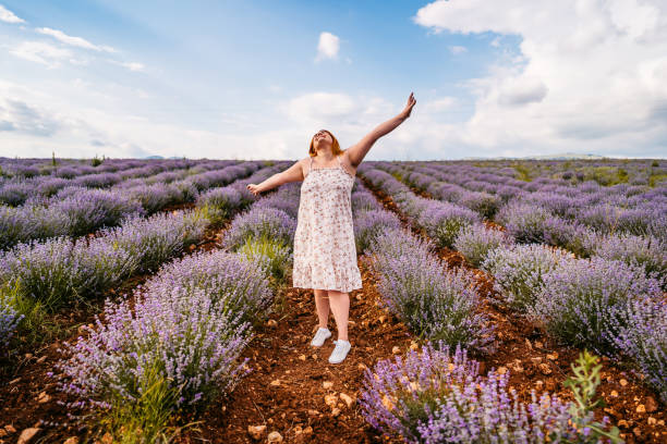 istock Young overweight woman in lavender field 1332003207