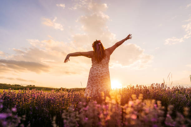 istock Young overweight woman in lavender field 1332003241