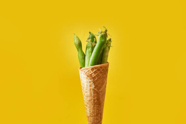 istock Raw pea vegetables in ice-cream cone 1332005923